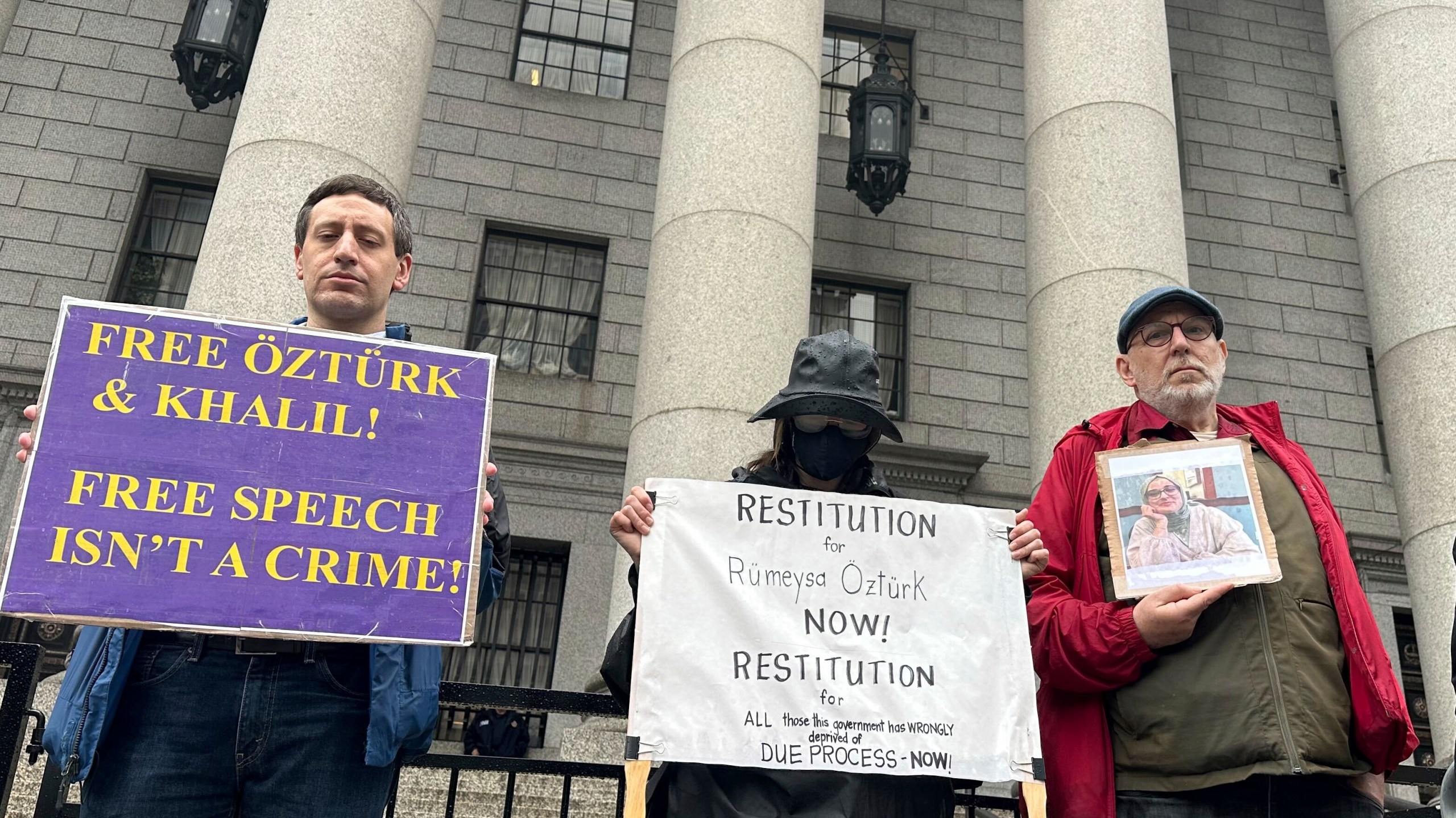 Protesters hold up signs outside court as a federal appeals court is scheduled to hear arguments in the cases of a Turkish Tufts University student who has been detained by immigration authorities for six weeks and a Palestinian student at Columbia University who was recently released from detention on Tuesday, May 6, 2025 in New York. (AP Photo/David Martin)