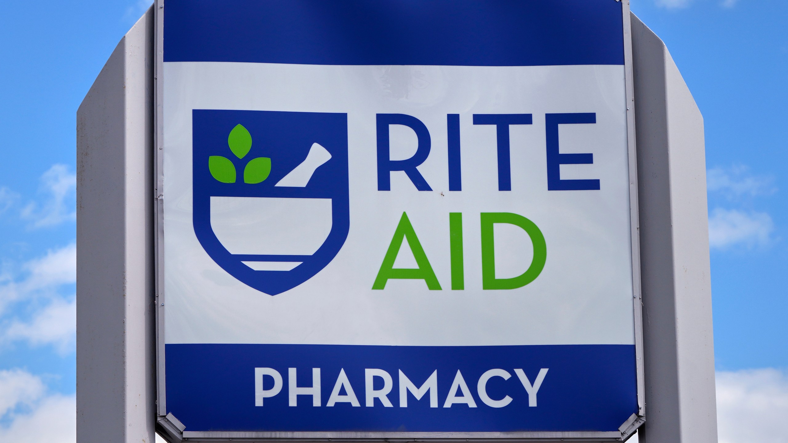FILE - A sign with the company's logo stands outside a Rite Aid store in Salem, N.H., on Wednesday, May 29, 2024. (AP Photo/Charles Krupa, File)