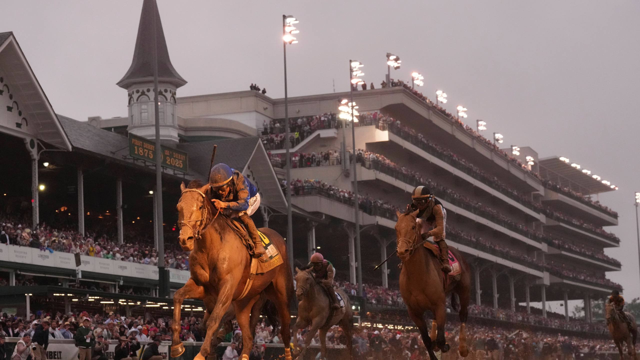 Sovereignty, ridden by Junior Alvarado, left, crosses the finish line to win the 151st running of the Kentucky Derby horse race at Churchill Downs Saturday, May 3, 2025, in Louisville, Ky. (AP Photo/Abbie Parr)