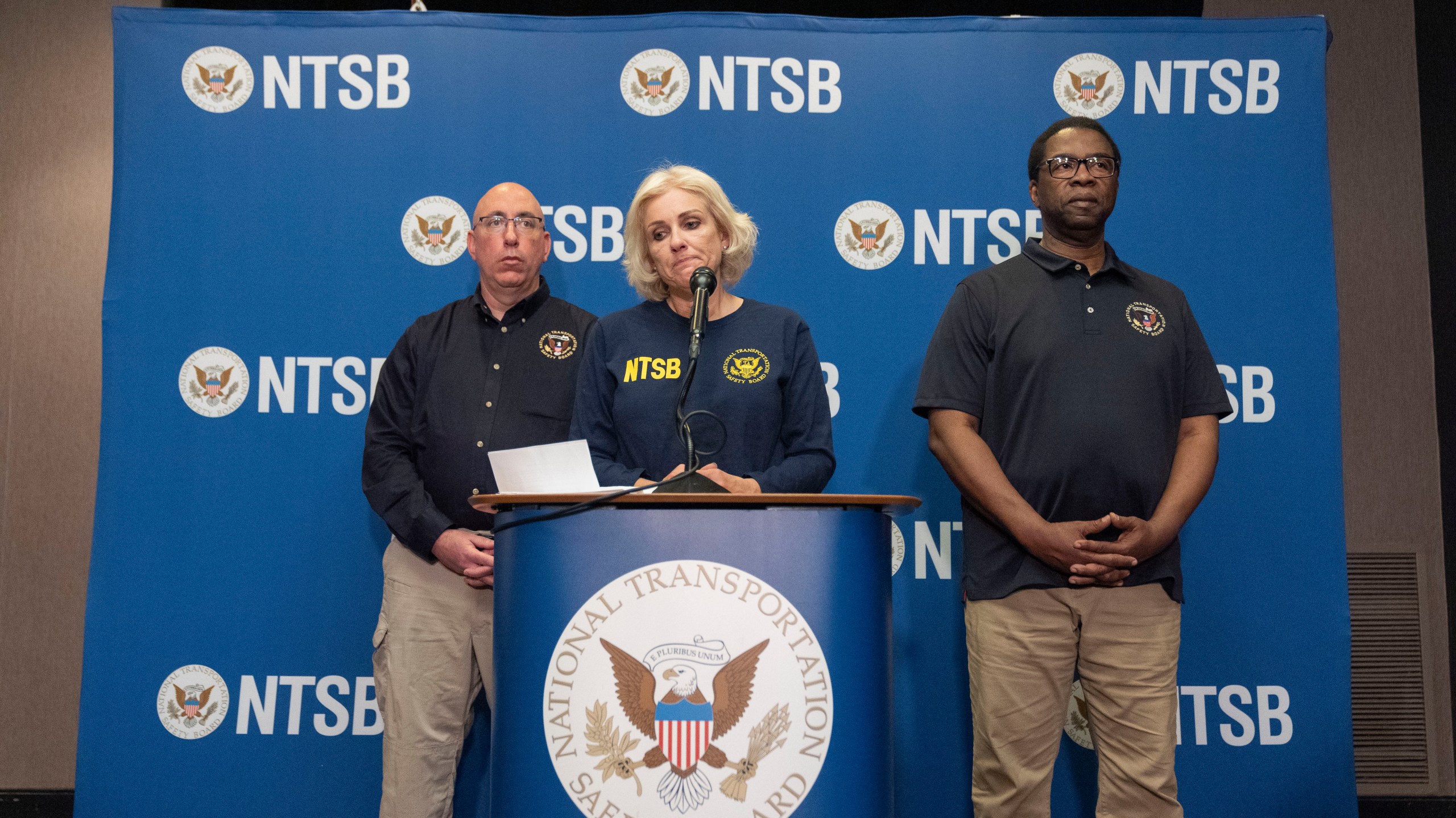 FILE - National Transportation Safety Board Chair Jennifer Homendy, center, pauses while speaking accompanied by NTSB Investigator in Charge, Marcel Muise, left, and NTSB board member Alvin Brown, during a news conference, March 27, 2024, in Linthicum Heights, Md. (AP Photo/Alex Brandon, File)