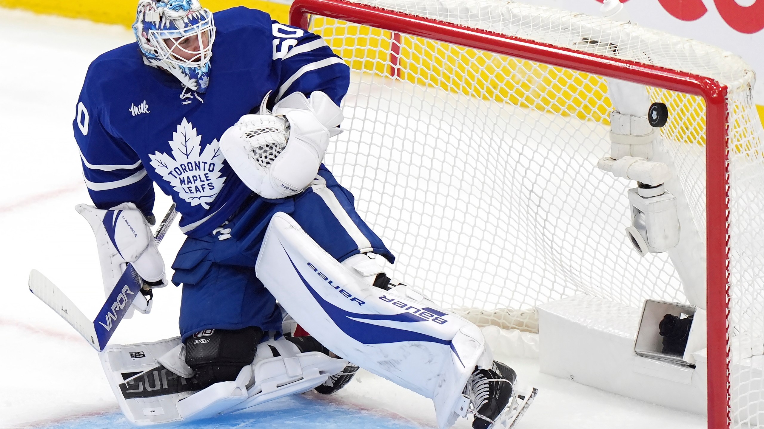 Toronto Maple Leafs goaltender Joseph Woll watches the puck go into the net as the Florida Panthers score during the third period of Game 1 in an NHL hockey second-round playoff series in Toronto, Monday, May 5, 2025. (Frank Gunn/The Canadian Press via AP)