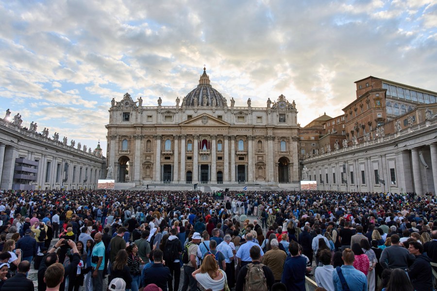 People wait for the smoke billowing from the chimney of the Sistine Chapel, where 133 cardinals are gathering on the first day of the conclave, indicating that a successor of late Pope Francis was elected or not, Wednesday, May 7, 2025. (AP Photo/Bernat Armangue)
