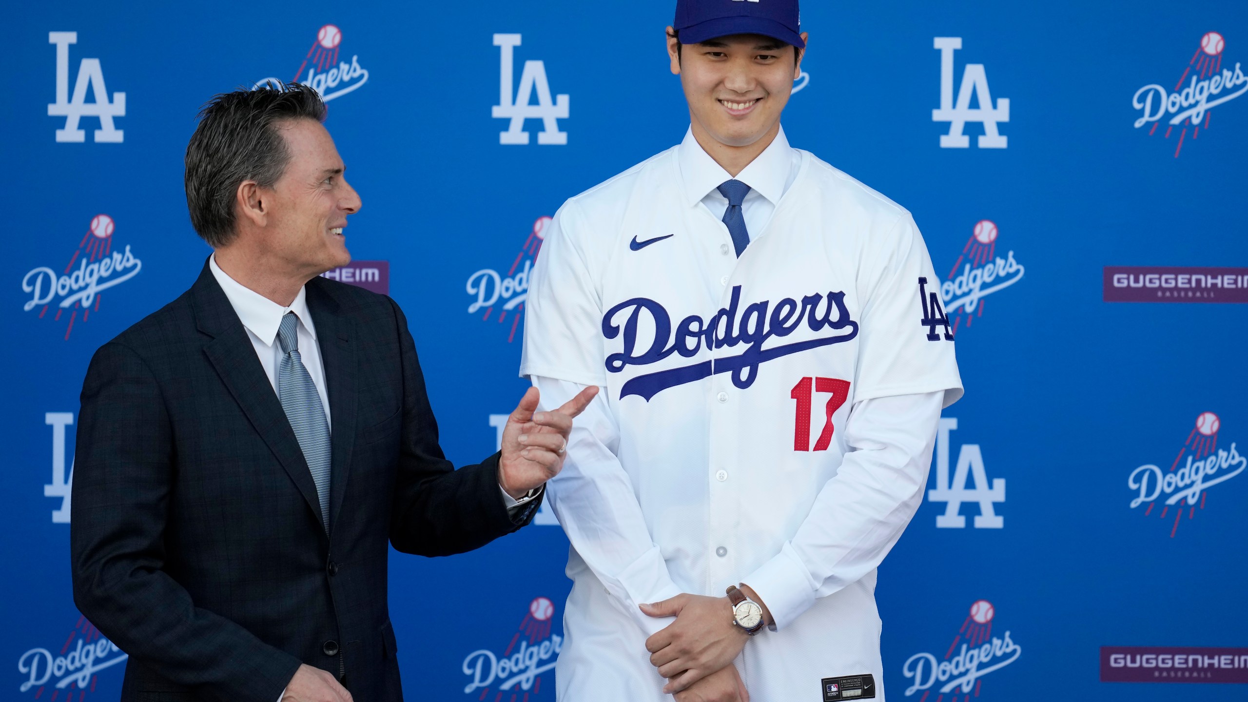 FILE - Los Angeles Dodgers' Shohei Ohtani, right, stands for photos next to agent Nez Balelo during a baseball news conference at Dodger Stadium Thursday, Dec. 14, 2023, in Los Angeles. (AP Photo/Ashley Landis, File)