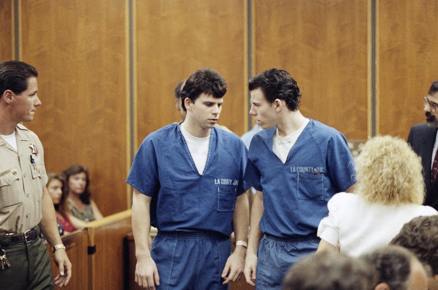 FILE - Lyle, left, and Erik Menendez leave a courtroom in Santa Monica, Calif., Aug. 6, 1990, after a judge ruled that conversations between the brothers and their psychologist after their parents were slain were not privileged and could be used as evidence. (AP Photo/Nick Ut, File)