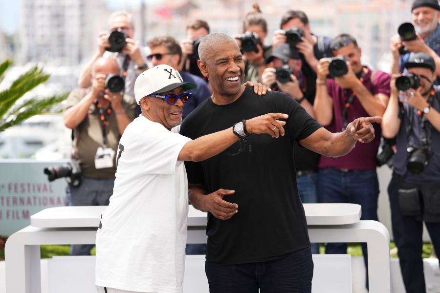 Director Spike Lee, left, and Denzel Washington pose for photographers at the photo call for the film 'Highest 2 Lowest' at the 78th international film festival, Cannes, southern France, Monday, May 19, 2025. (Photo by Scott A Garfitt/Invision/AP)