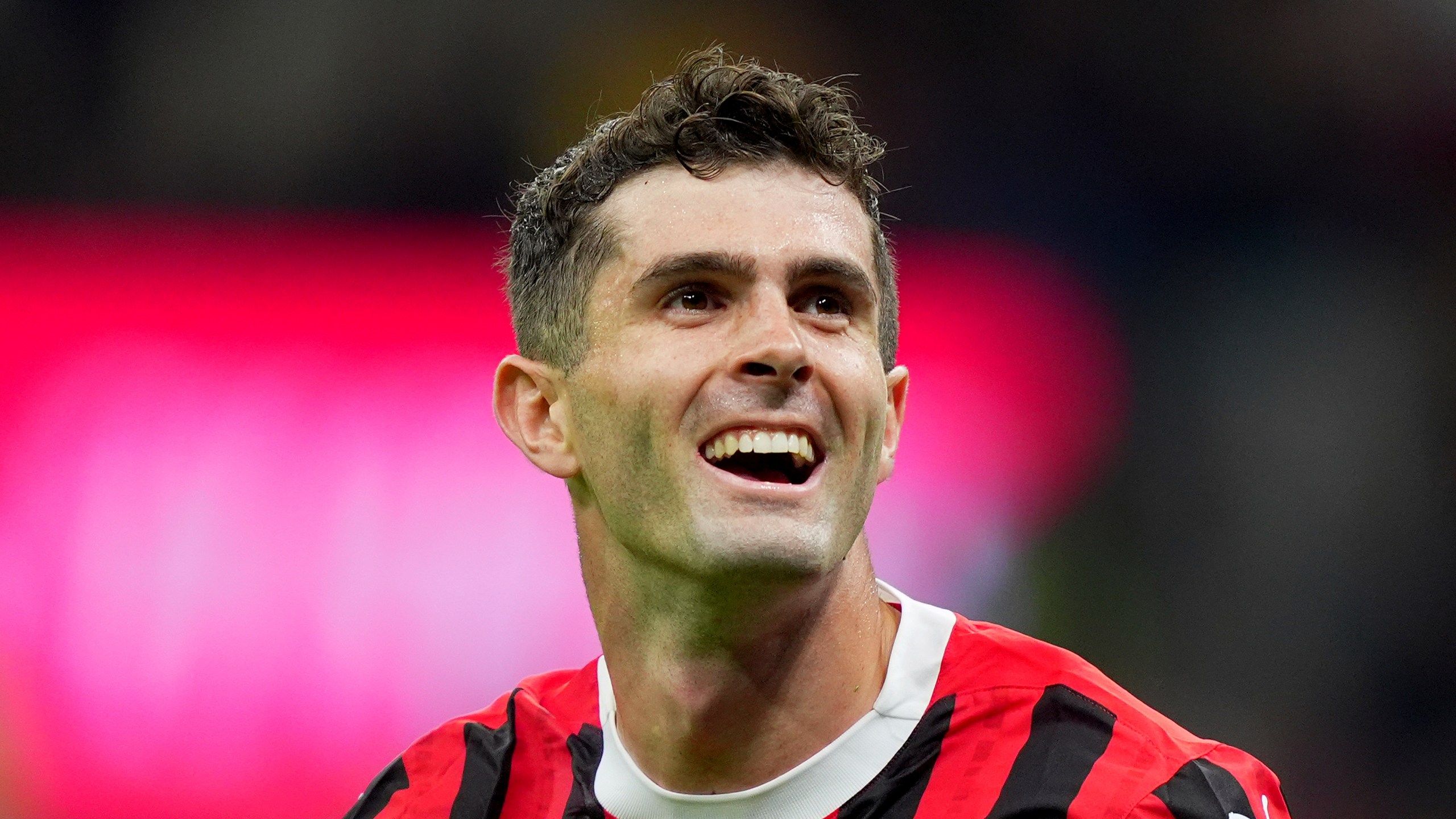 AC Milan's Christian Pulisic celebrates after scoring their second goal of the game during the Serie A soccer match between Milan and Bologna at San Siro Stadium in Milan, Italy, Friday May 9, 2025. (Spada/LaPresse via AP)