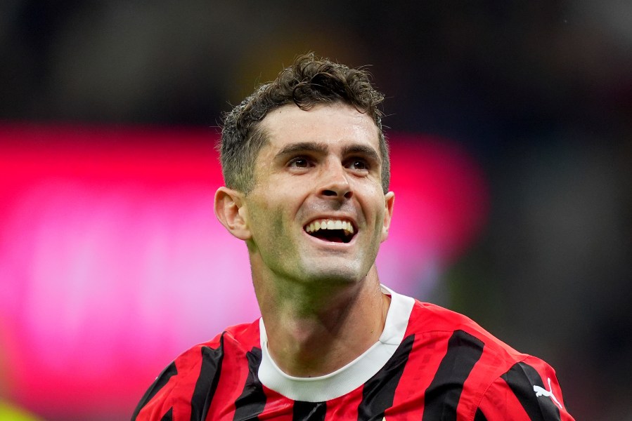 AC Milan's Christian Pulisic celebrates after scoring their second goal of the game during the Serie A soccer match between Milan and Bologna at San Siro Stadium in Milan, Italy, Friday May 9, 2025. (Spada/LaPresse via AP)