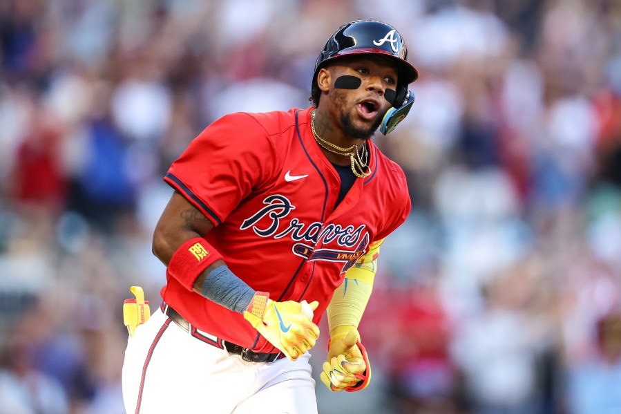 Atlanta Braves' Ronald Acuna Jr. reacts after hitting a home run in the first inning of a baseball game against the San Diego Padres, Friday, May 23, 2025, in Atlanta. (AP Photo/Colin Hubbard)