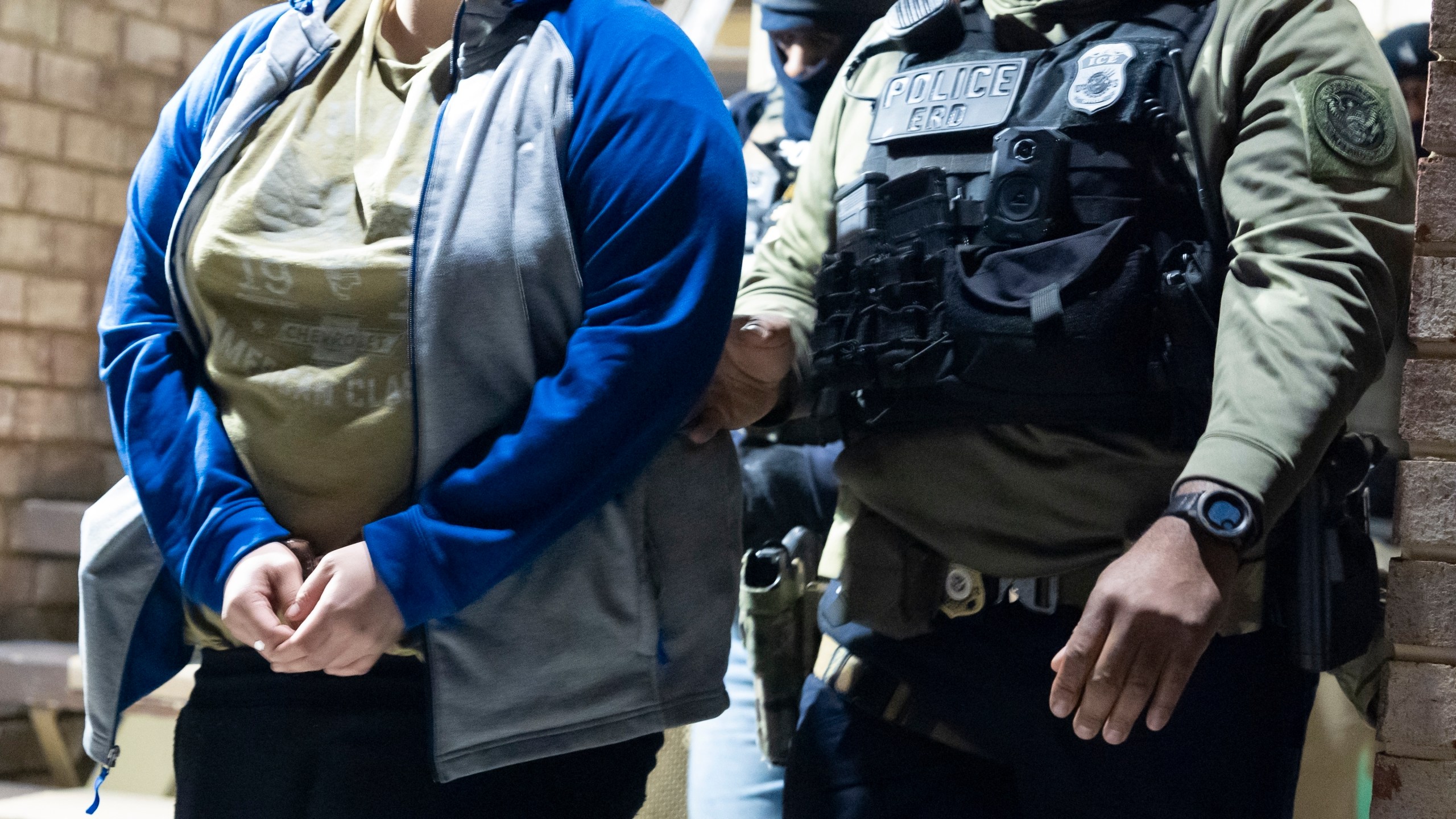 FILE - U.S. Immigration and Customs Enforcement officers detain a person, left, Monday, Jan. 27, 2025, in Silver Spring, Md. (AP Photo/Alex Brandon, File)