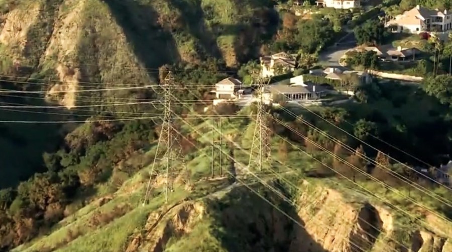 One of two Southern California Edison transmission towers was dismantled and removed from a steep hillside in Eaton Canyon on May 7, 2025, as part of an investigation into whether the towers played a role in the deadly Eaton fire in Altadena. (KTLA)