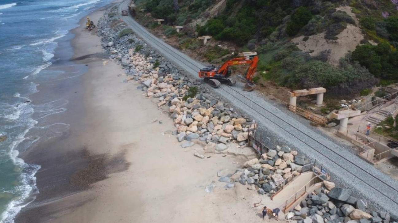 Crews place riprap, large rocks and boulders, along the coastal rail line that runs through Orange County, as seen in this May 16, 2025 update from OCTA. (Orange County Transportation Authority)