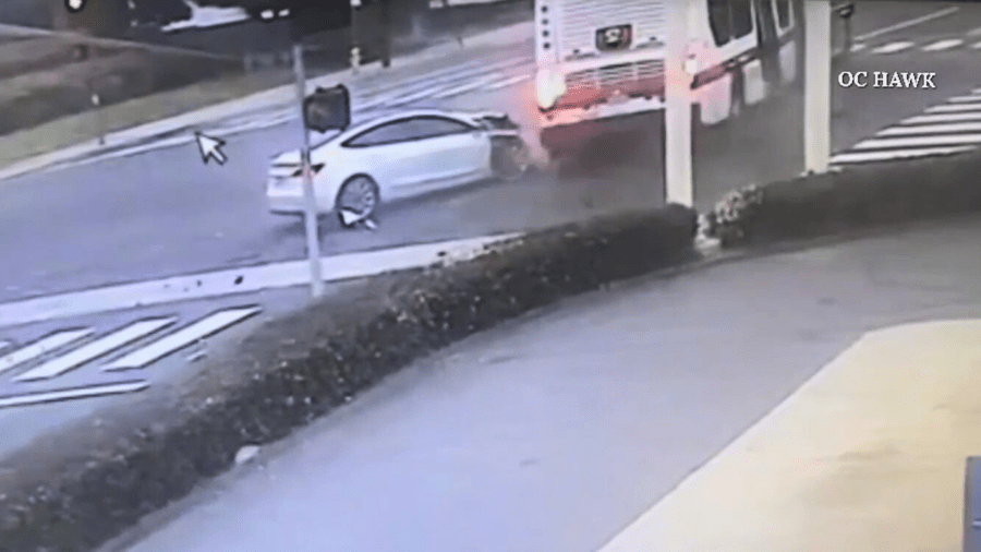 Two people were killed after a driver in a Tesla Model 3 ran a red light and crashed into a bus in Orange County on April 12, 2025. (OC Hawk)