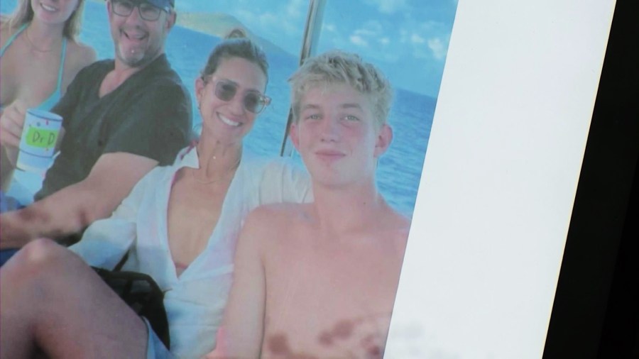 Photos of Levi Braun, friends and family at left at a growing memorial at the Manhattan Beach crash site. (KTLA)