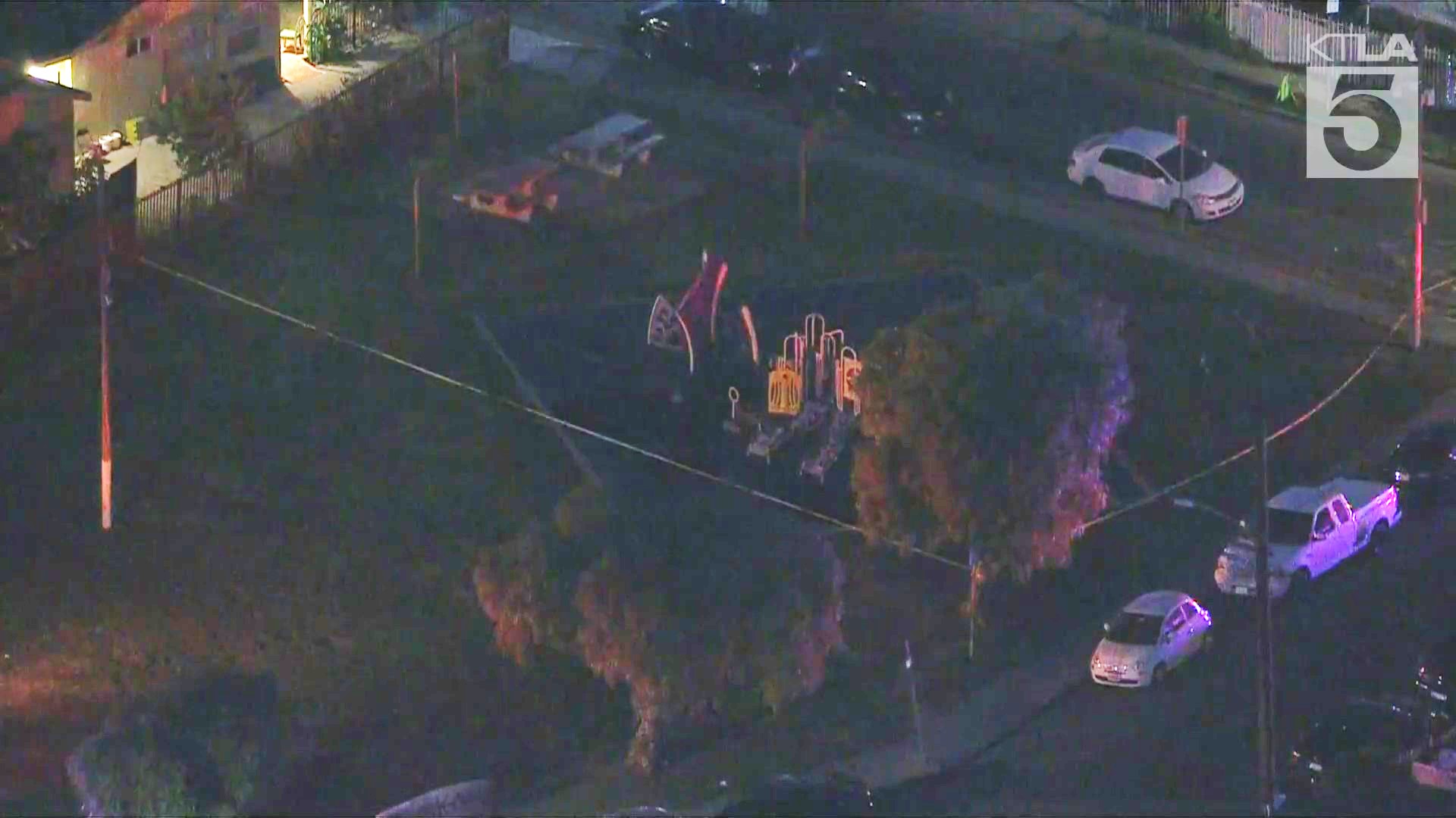 A small playground at Fig/Oleander Park in Compton was cordoned off after a boy was found shot to death on May 9, 2025. (KTLA)