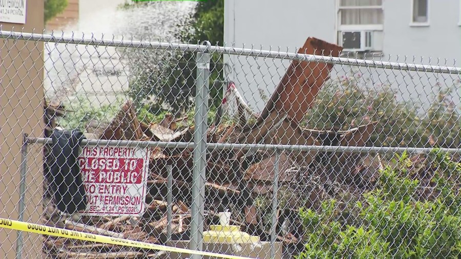 L.A. Fire Department crews demolished a vacant home that neighbors said was taken over by squatters in Hollywood after a massive fire destroyed the property on May 1, 2025. (KTLA)