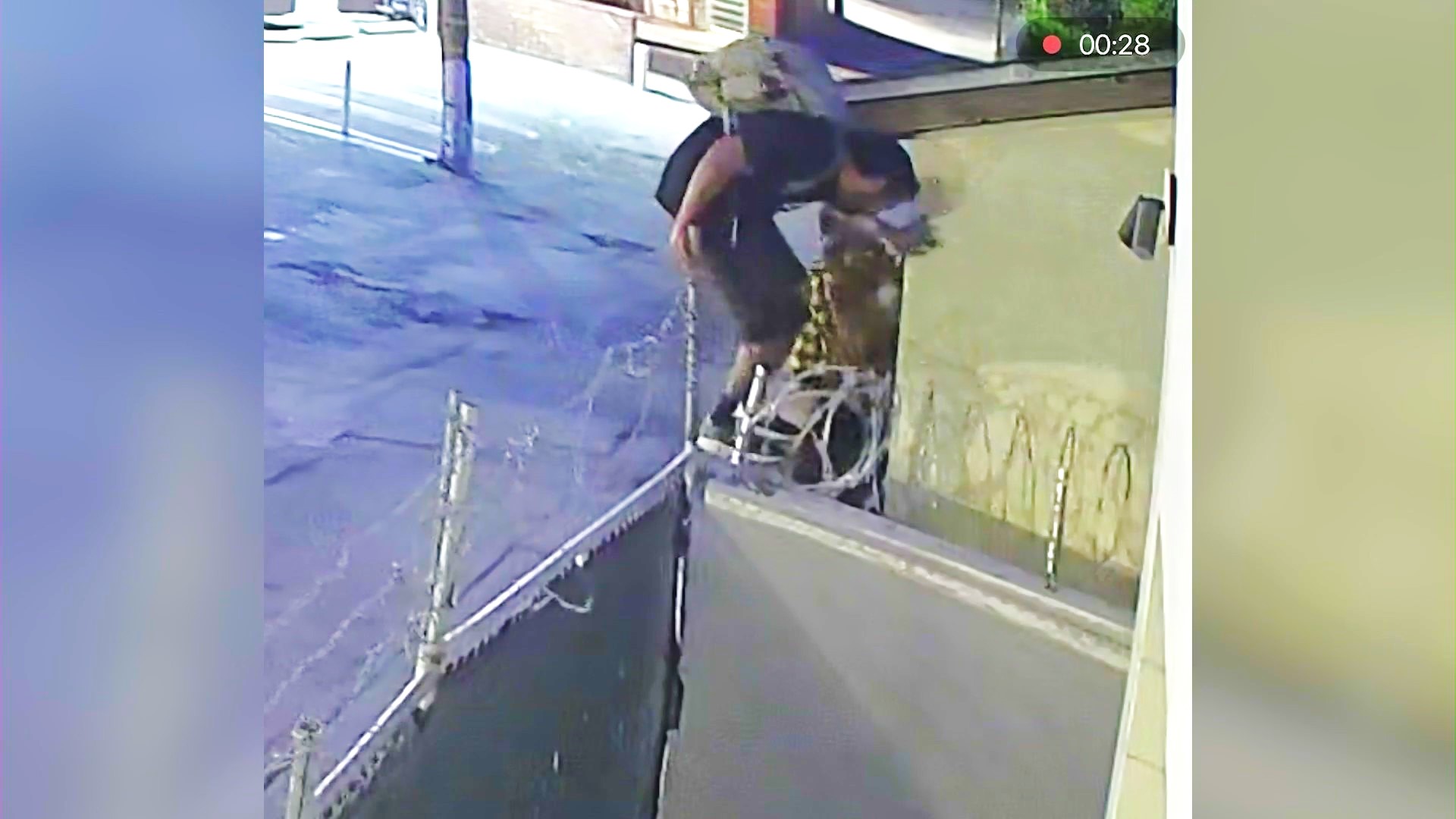 A squatter breaking into a problem property in a Westwood neighborhood.