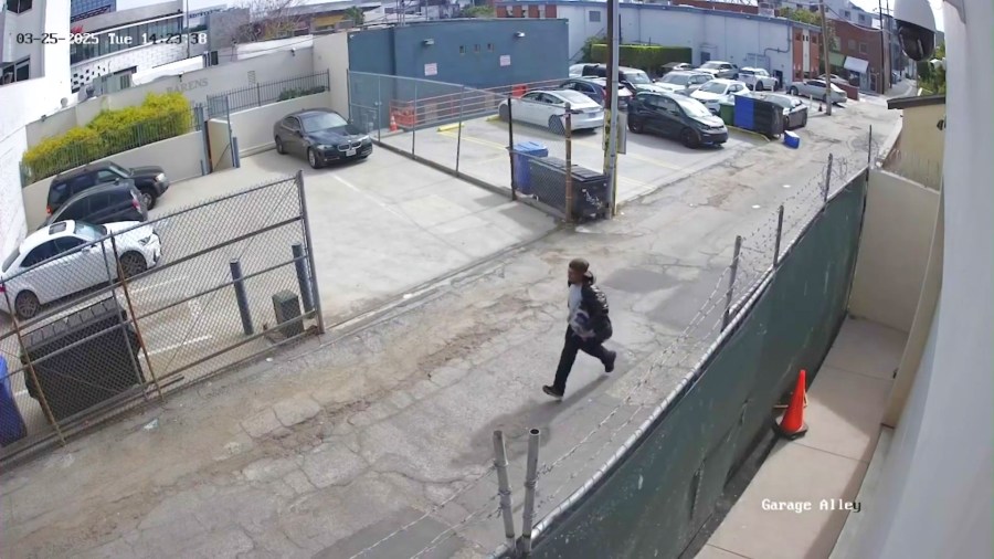 An intruder leaving a problem property in a Westwood neighborhood.