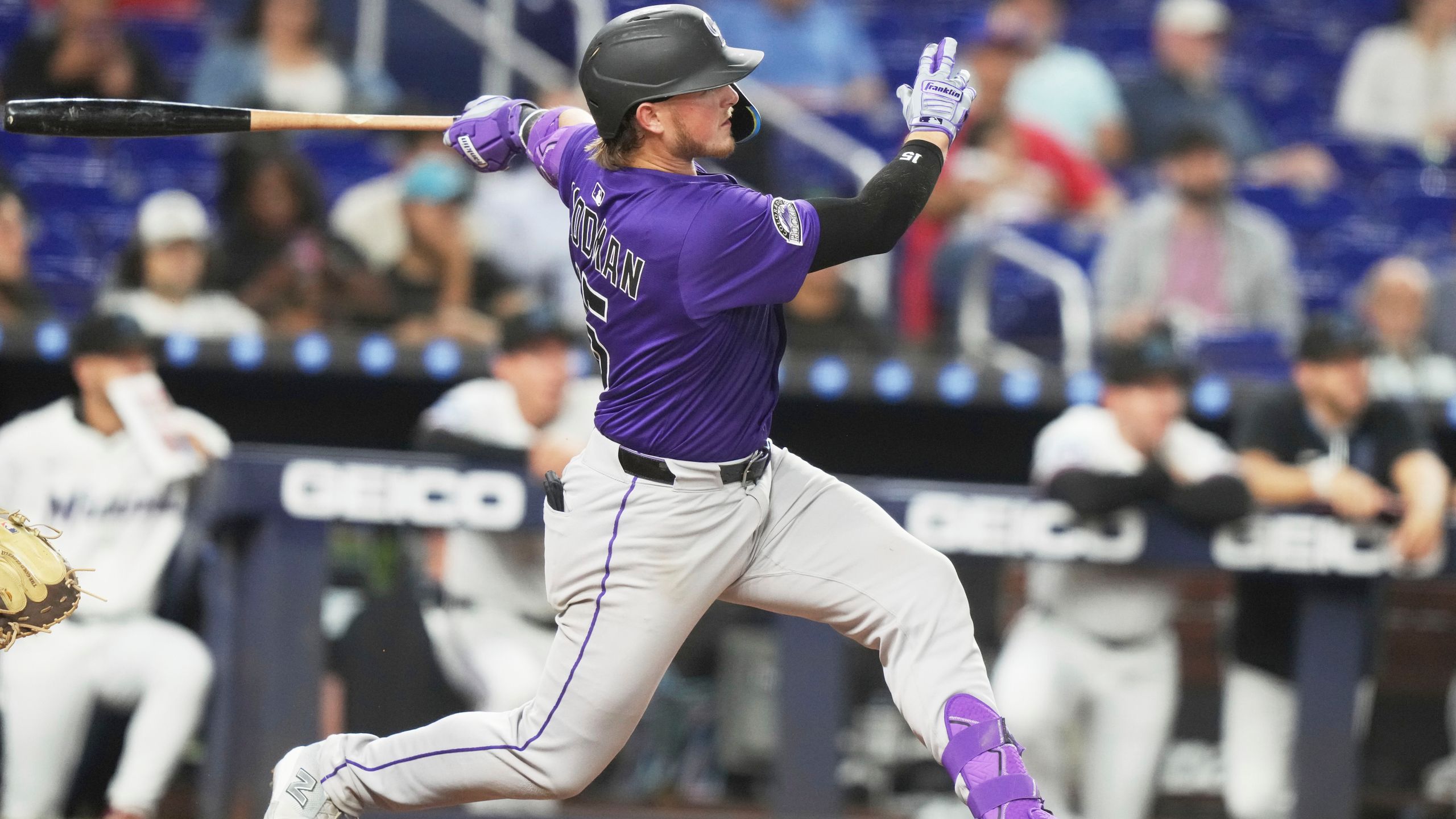 Colorado Rockies' Hunter Goodman follows through on a solo home run during the eighth inning of a baseball game against the Miami Marlins, Tuesday, June 3, 2025, in Miami. (AP Photo/Lynne Sladky)