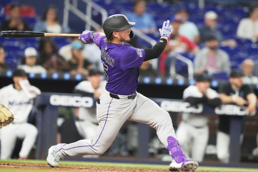 Colorado Rockies' Hunter Goodman follows through on a solo home run during the eighth inning of a baseball game against the Miami Marlins, Tuesday, June 3, 2025, in Miami. (AP Photo/Lynne Sladky)