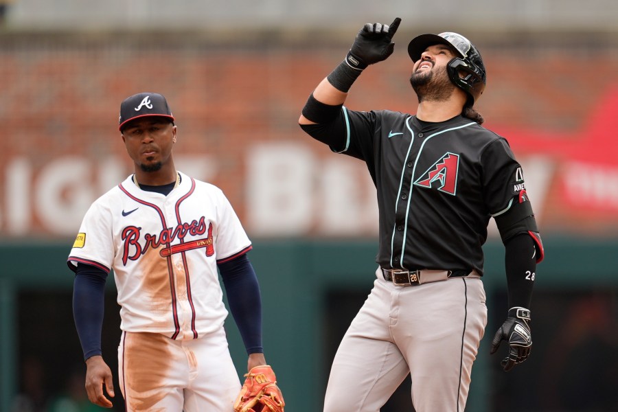 Arizona Diamondbacks third baseman Eugenio Suárez (28) celebrates his two-RBI double against the Atlanta Braves in the ninth inning of a baseball game, Thursday, June 5, 2025, in Atlanta. (AP Photo/Mike Stewart)