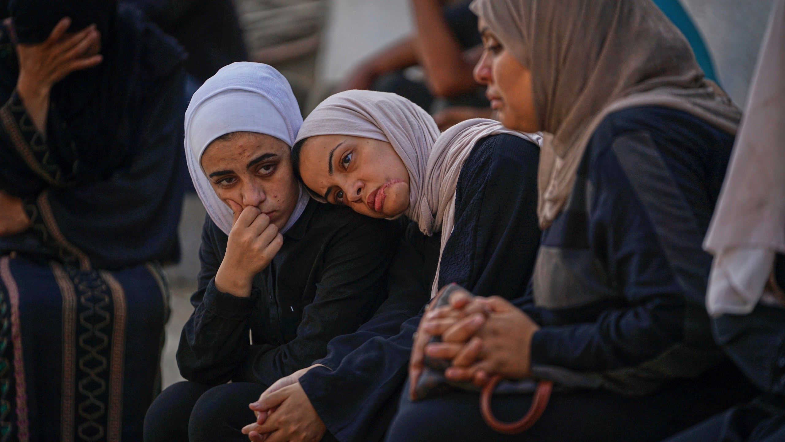 Relatives of Palestinians killed in Israeli army strikes wait for their burials at Shifa hospital in Gaza City, Thursday, June 26, 2025. (AP Photo/Jehad Alshrafi)