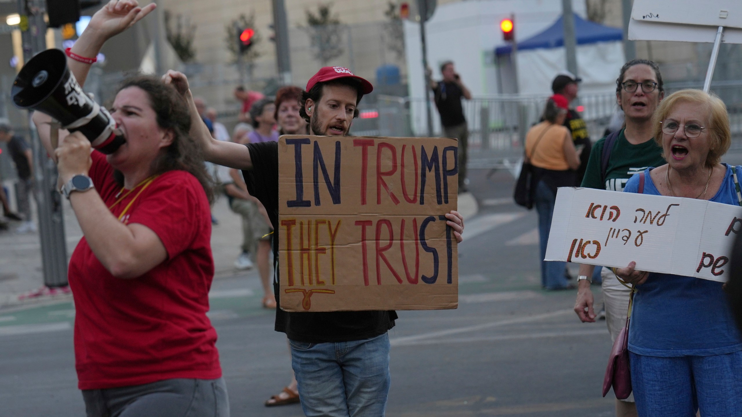 People take part in a protest demanding the end of the war and immediate release of hostages held by Hamas in the Gaza Strip, and against Prime Minister Benjamin Netanyahu's government in Tel Aviv, Israel, Saturday, June 28, 2025. (AP Photo/Ariel Schalit)