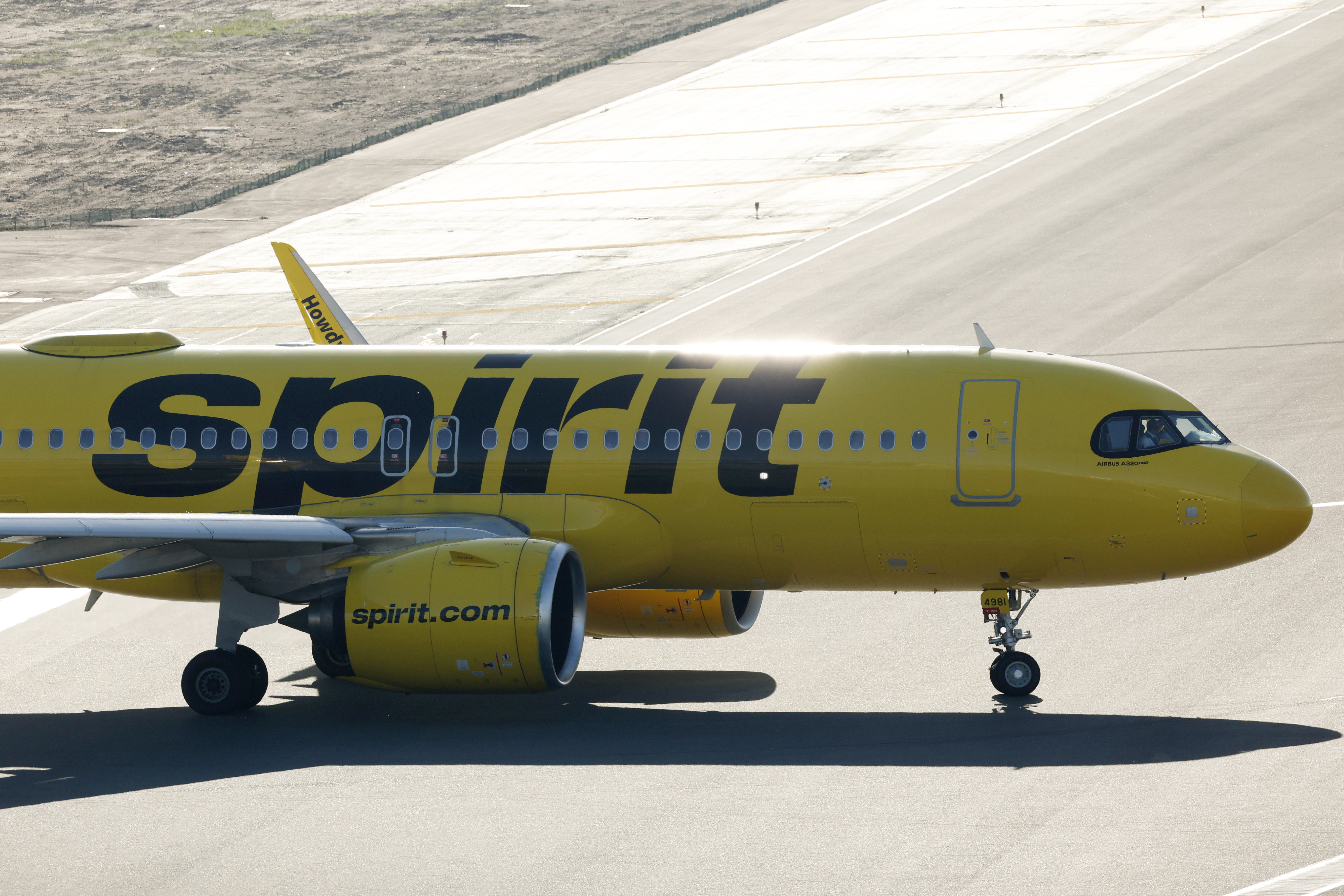 A Spirit Airlines Airbus A320 airplane taxis a California runway. The airline was forced to evacuate an LAX-bound flight from Detroit June 5th, due to a bomb threat. (Photo by Kevin Carter/Getty Images)