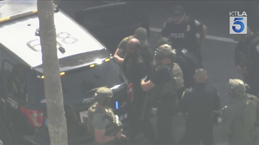 Sky5 captured the moment law enforcement officers took a person into custody in Santa Monica following a neighborhood-wide search for the suspect in two separate shootings in the city; June 25, 2025. (KTLA)