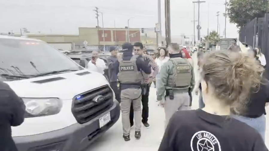 SEIU President David Huerta is pushed by a federal agent to move away from an SUV that was used in an immigration enforcement operation in downtown L.A. (US Attorney Bill Essayli)