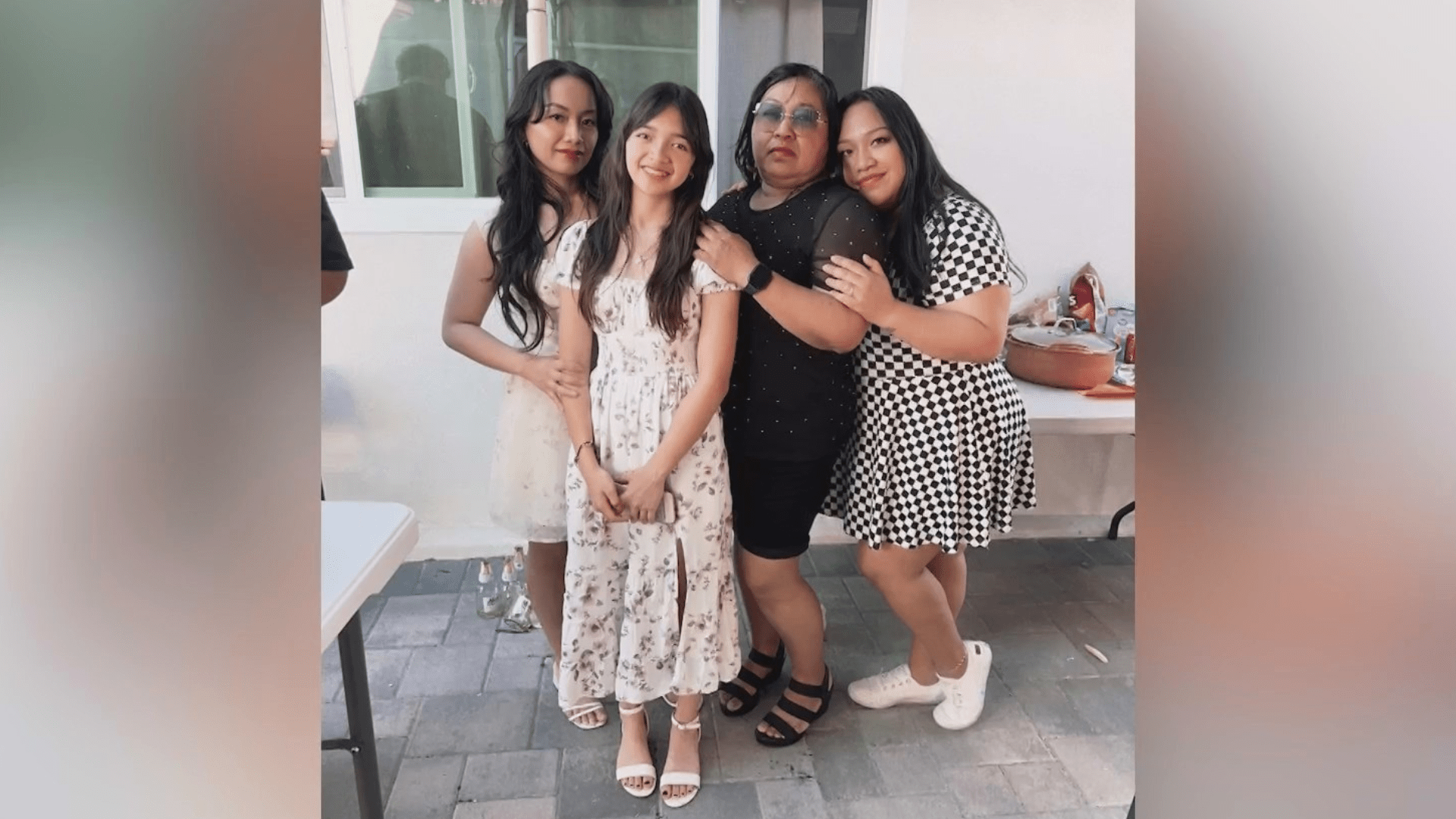 Regina (second from right) is seen with her family.