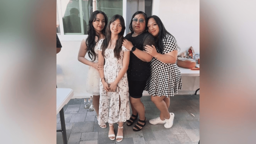 Regina (second from right) is seen with her family.