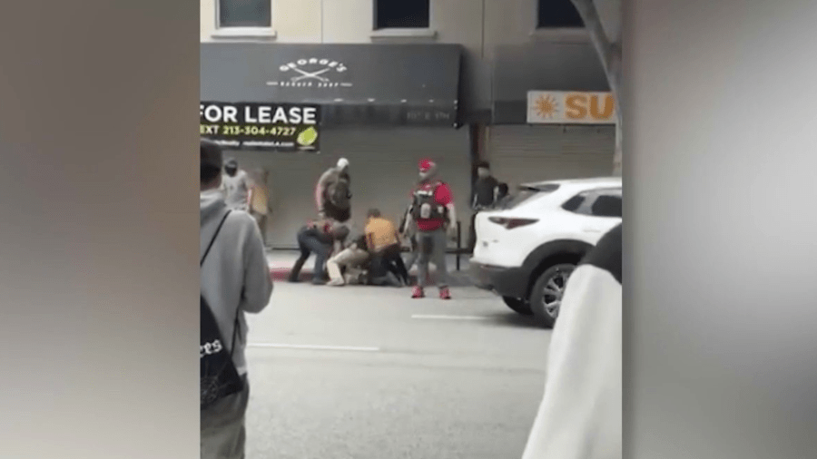 Andrea Velez, 32, a U.S. citizen and South L.A. native, was suddenly forced to the ground and detained by immigration agents while she was walking to work in downtown Los Angeles on June 24, 2025. (@uniondelbarrio)