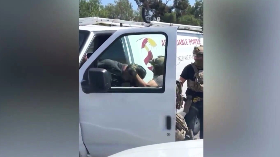 Arturo Hermosillo being forcefully removed from his van for allegedly filming a federal immigration raid at a shopping plaza in Pacoima on June 19, 2025.