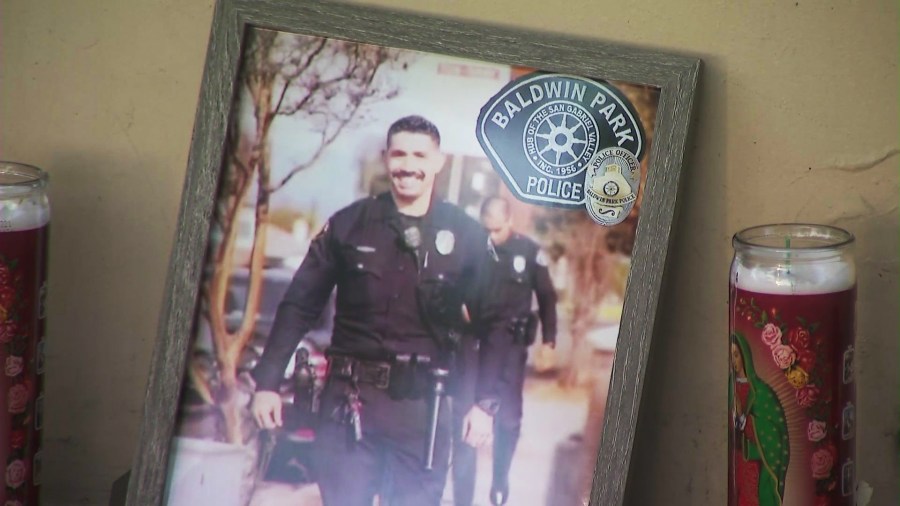 Loved ones, colleagues and community members gathered for a candlelight vigil to honor the life of Officer Samuel Riveros outside Baldwin Park City Hall on June 6, 2025. (KTLA)