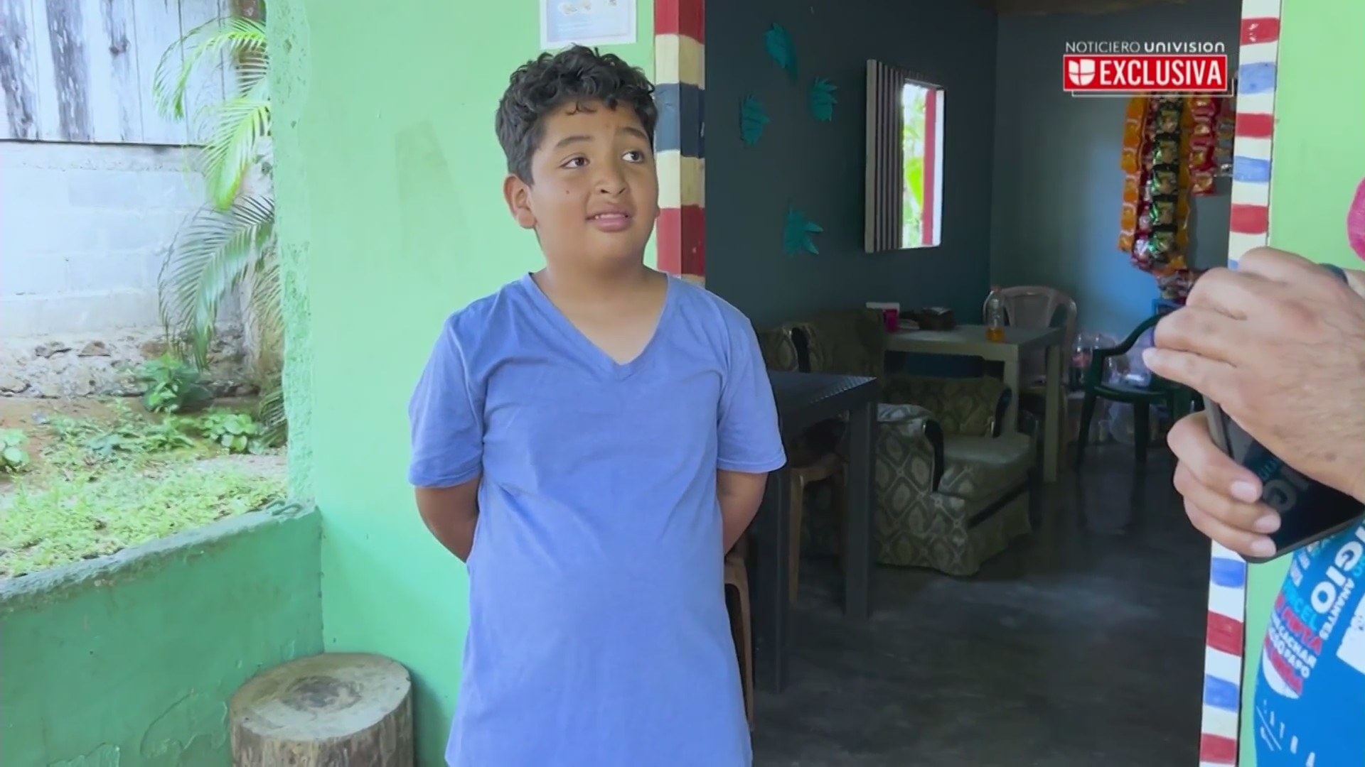 Martir Garcia Lara, 9, speaks with a Univision reporter after he and his father were deported from Southern California and back to Temputitalpa, Honduras. (Univision)