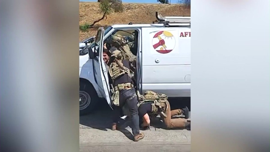 Arturo Hermosillo being forcefully removed from his van for allegedly filming a federal immigration raid at a shopping plaza in Pacoima on June 19, 2025.