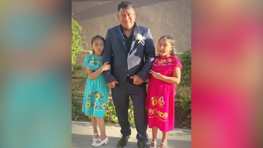 Carlos Mejia Osorio and his daughters are seen in a family photo.