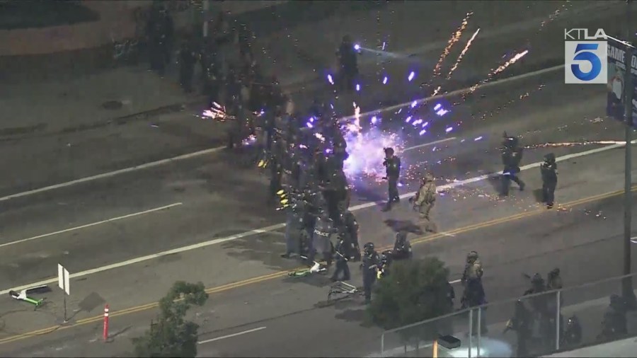 Federal officers created a skirmish line to push back protestors gathered in downtown Los Angeles on Saturday night over ICE raids happening in SoCal. Gil Leyvas reports from Sky5 on June 7, 2025. (KTLA)