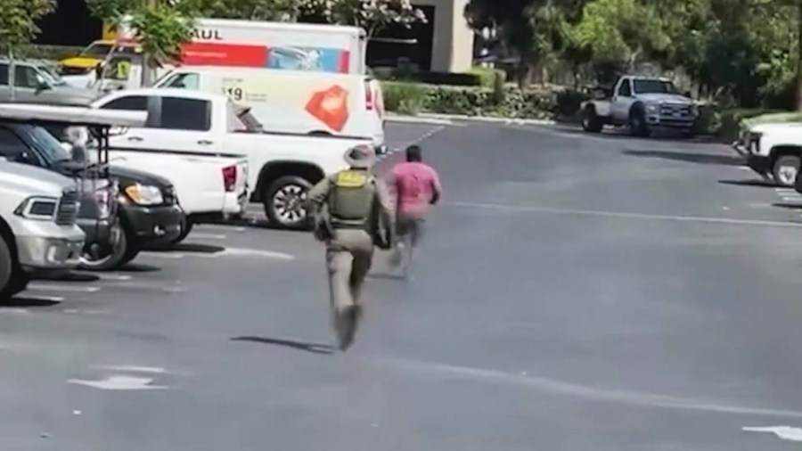 Video captured the moment federal immigration agents chased Carlos Mejia Osorio in the parking lot of a Home Depot in Burbank on June 19, 2025. (@mayornikkiperez)