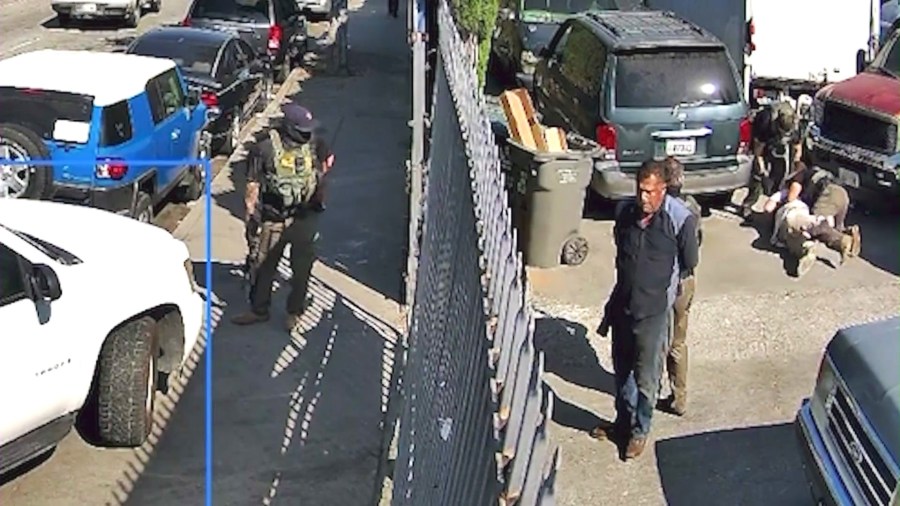 Surveillance video captured the moment several masked and armed agents surrounded a tow truck shop in Montebello during an immigration raid on June 12, 2025.