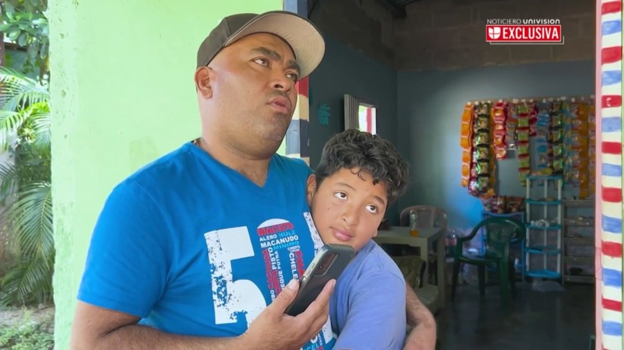 Martir Garcia Lara, 9, and his father, Martir Garcia-Banegas, 50, speak with a Univision reporter after he and his father were deported from Southern California and back to Temputitalpa, Honduras. (Univision)