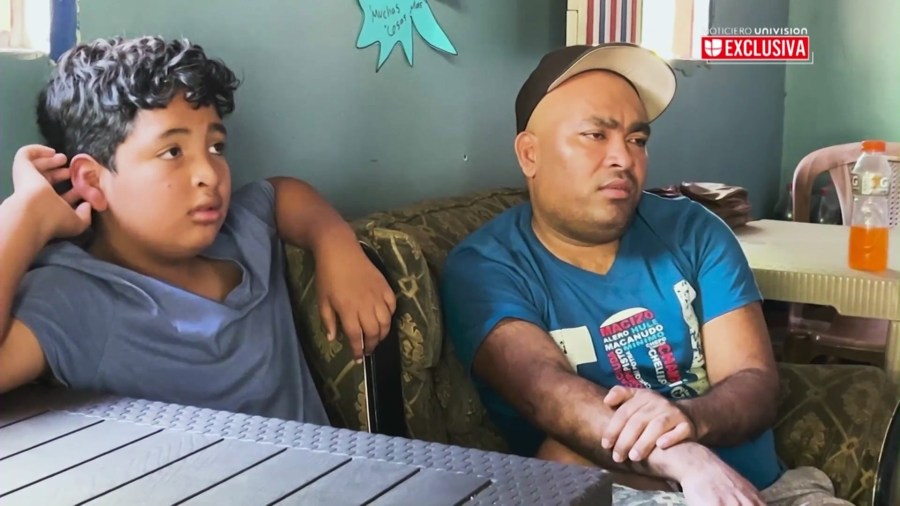 Martir Garcia Lara, 9, and his father, Martir Garcia-Banegas, 50, speak with a Univision reporter after he and his father were deported from Southern California and back to Temputitalpa, Honduras. (Univision)