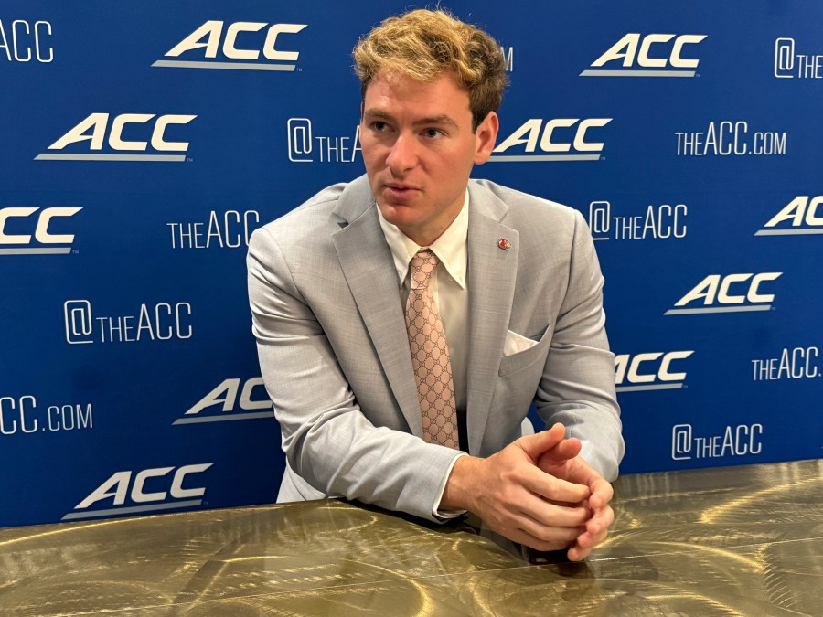 Louisville quarterback Miller Moss, a transfer from Southern California, speaks at the Atlantic Coast Conference NCAA college football media days, Wednesda, July 23, 2025, in Charlotte, N.C. (AP Photo/Steve Reed)
