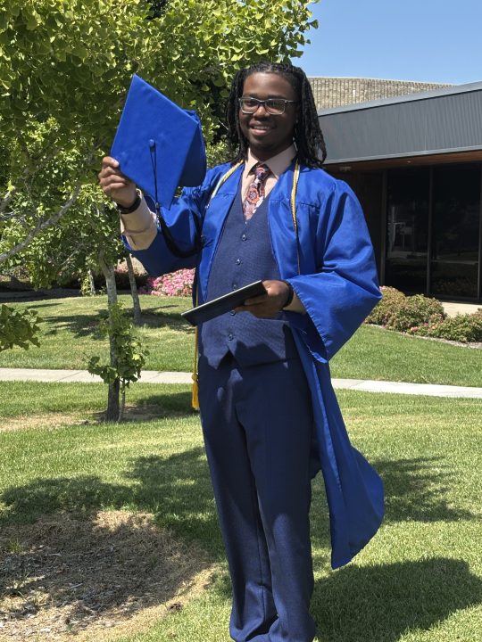Ean, a 17-year-old graduate of a Los Angeles online public school celebrates graduating a year early in June 2025.