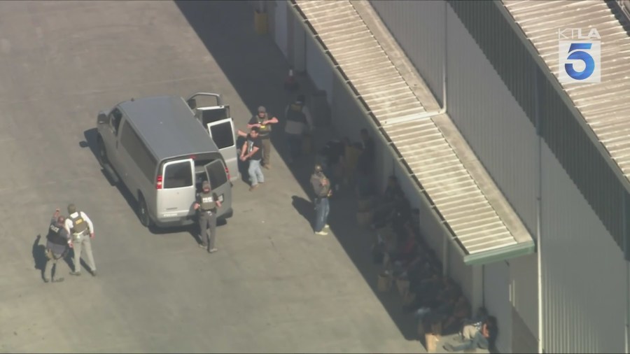 Federal agents began loading farm workers into several vans hours after they were detained during an hourslong immigration enforcement raid in Camarillo on July 10, 2025. (KTLA)