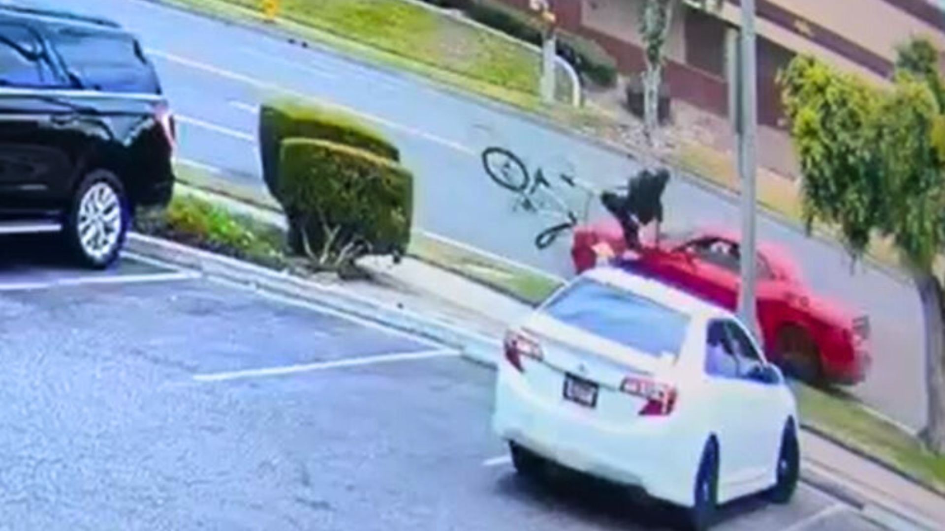 Surveillance video captured the moment a suspect in a Dodge Challenger struck a bicyclist head-on in Fullerton on July 22, 2025. (Fullerton Police Department)