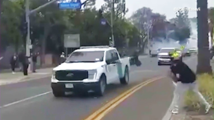 The suspect is allegedly seen throwing concrete blocks at federal officers' vehicle in Paramount during an immigraiton enforcement operation on June 8, 2025. (U.S. Attorney Bill Essayli)