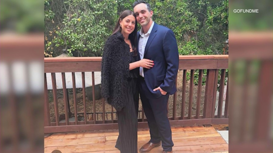 Justin Agulia, 33, is seen with his fiancée in a personal photo.