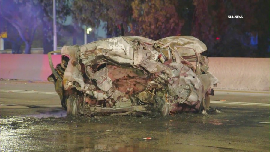 The victims' Nissan was totaled and burst into flames, fatally trapping four people inside, after a suspected DUI driver crashed into them at high-speeds on thr 605 Freeway in Norwalk on July 20, 2025. (KNN)