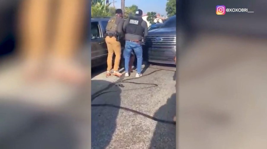 Cell phone video from a witness captured several masked immigration agents pulling a man and a pregnant woman from their SUV in Simi Valley and arresting them on July 3, 2025. (@xoxobri_)